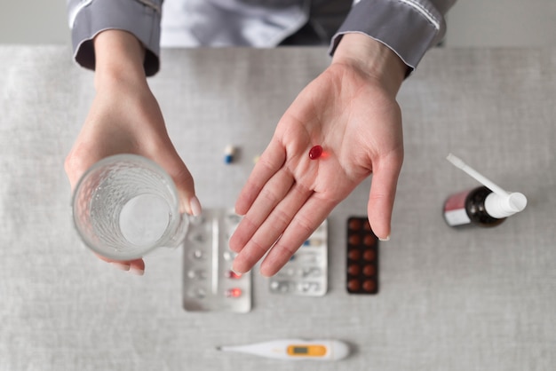 Free photo close up hand holding pill