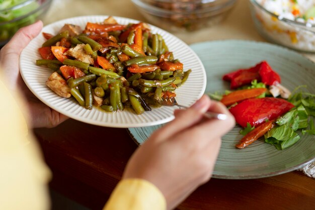 Close up hand holding plate