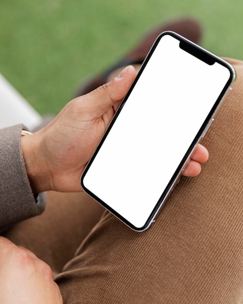 Close up hand holding smartphone