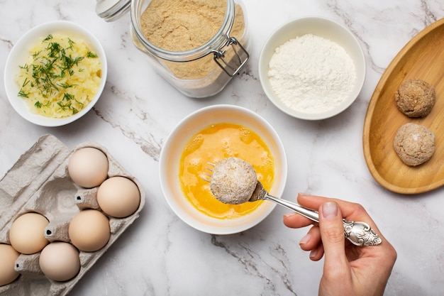 Close up hand holding spoon