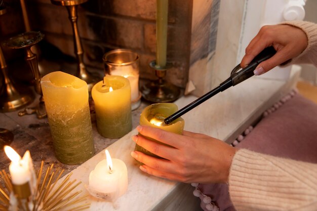 Close up hand lighting candle