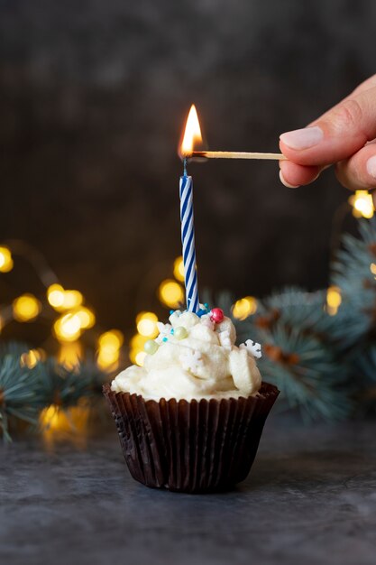 Close up hand lighting candle