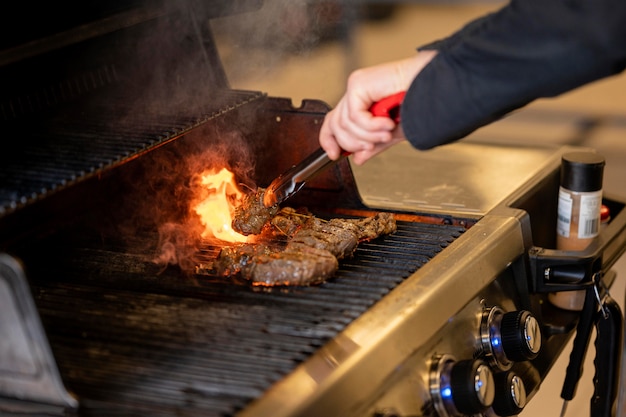 Free Photo close-up hand making barbeque