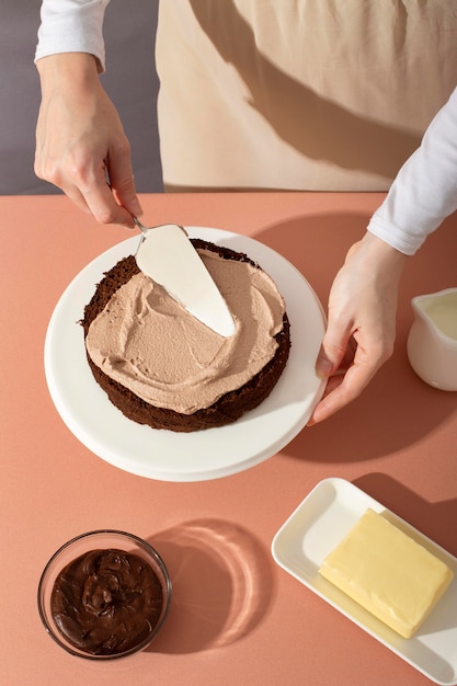 Close up hand making cake