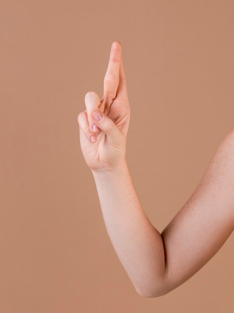 Close up of a hand teaching sign language