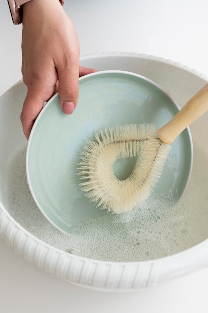 Close up hand washing dish