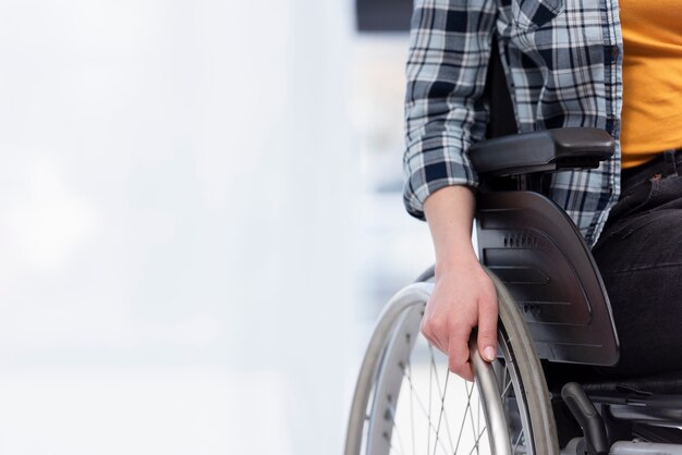 Close-up hand on wheel