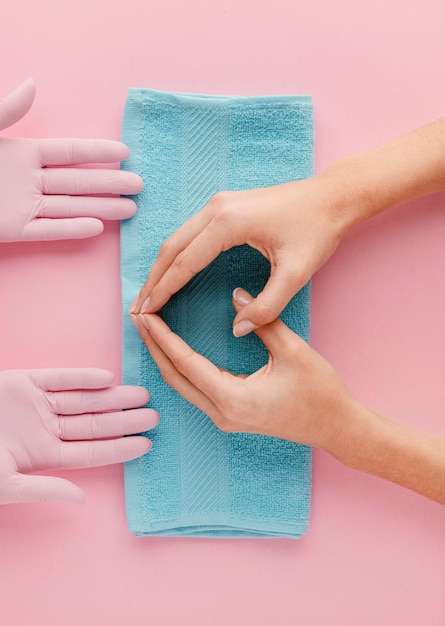 Close-up hands on blue towel