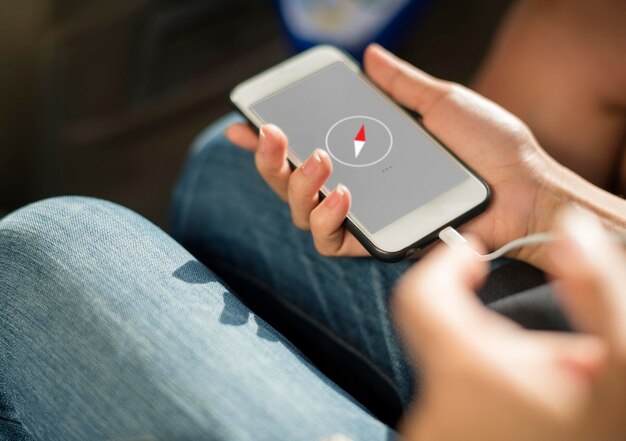 Close up of hands charging mobile phone