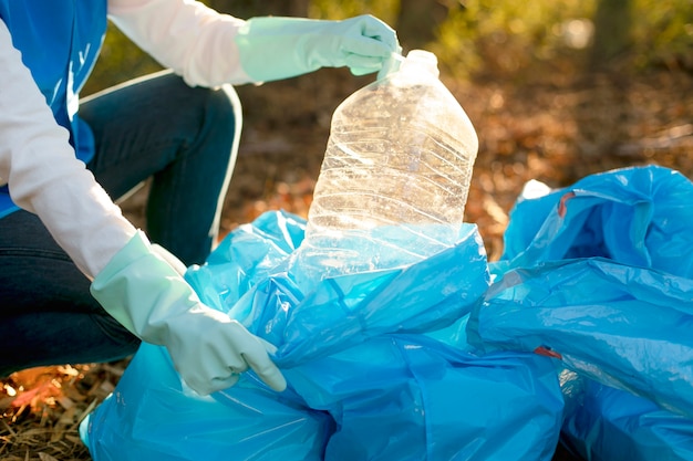 Free Photo close up hands collecting plastic