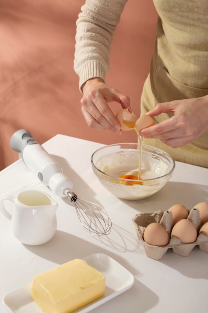 Close up hands cracking an egg