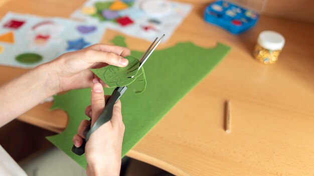 Close-up hands cutting material