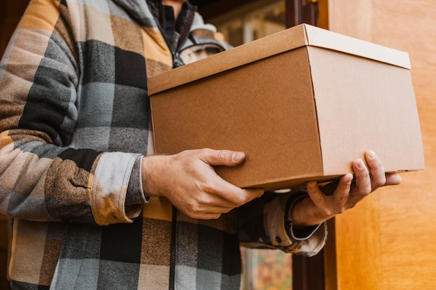 Close-up hands holding box