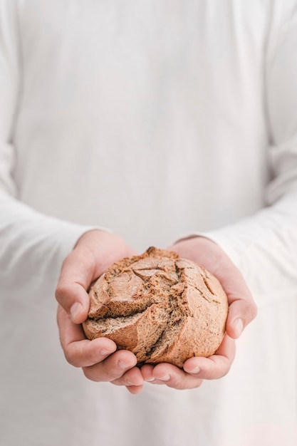 Close-up hands holding bread