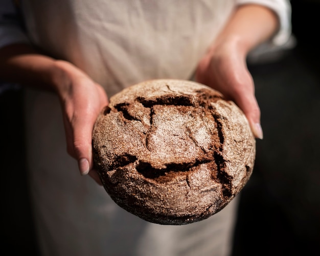 Close up hands holding bread