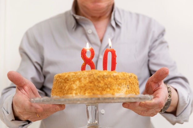 Close up hands holding cake plate