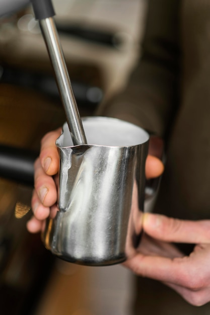 Free photo close up  hands holding coffee cup