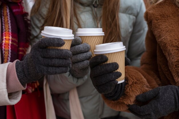 Close-up hands holding coffee cups