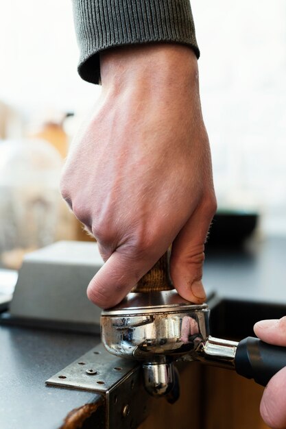 Close up  hands holding coffee making item