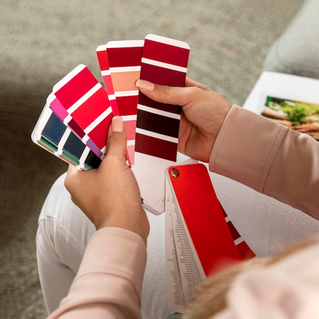 Close-up hands holding color palettes