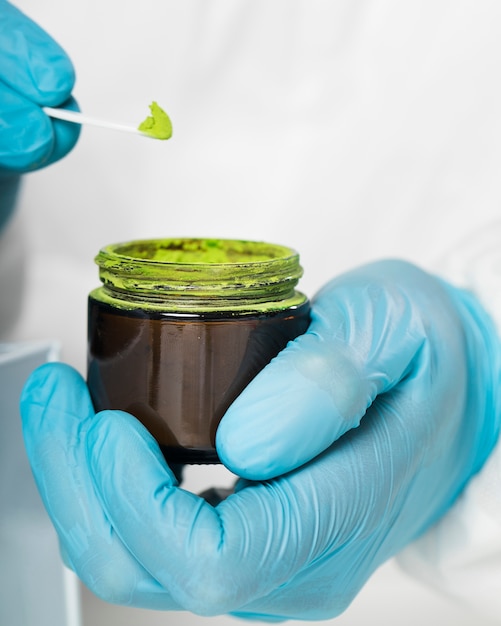 Free photo close-up hands holding colorful medical sample