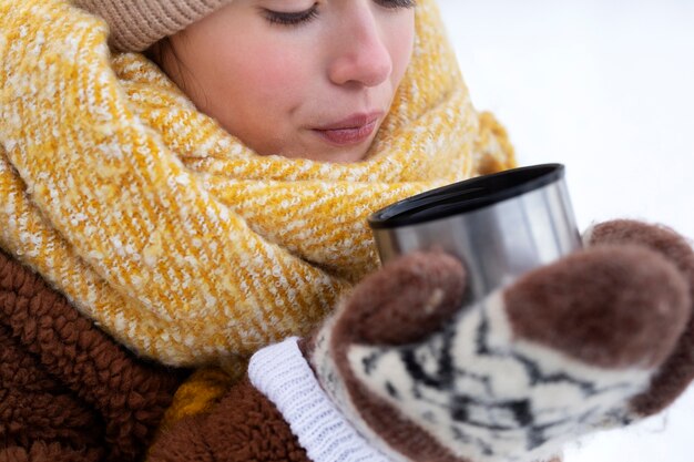 Close up hands holding cup