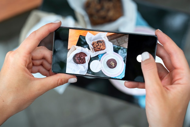 Free photo close up hands holding dessert photos