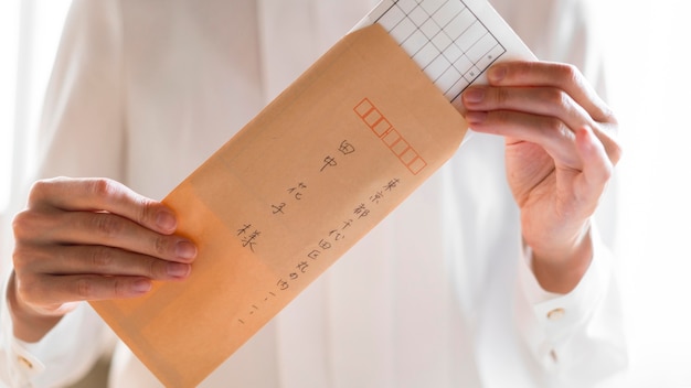 Close-up hands holding envelope