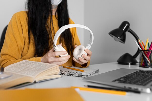 Close up hands holding headphones