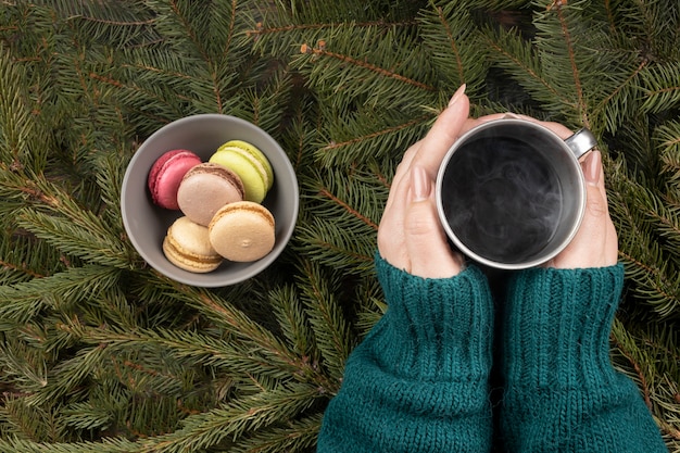 Free photo close up hands holding mug with hot drink