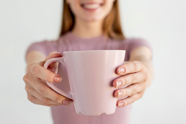 Close-up hands holding mug