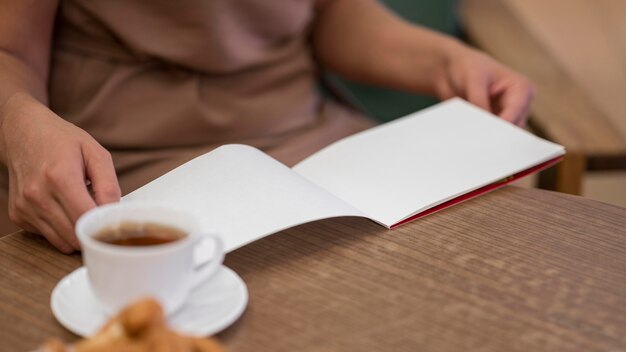 Close-up hands holding notebook