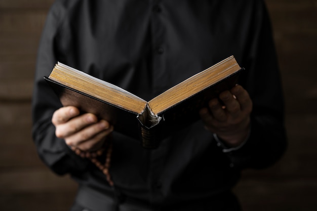 Close up hands holding open book