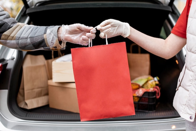 Close-up hands holding paper bag