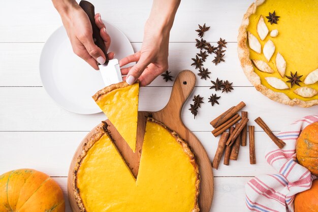 Close-up hands holding pie slice