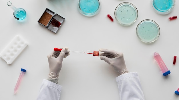 Close up  hands holding pipette