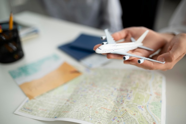 Free Photo close up hands holding small plane