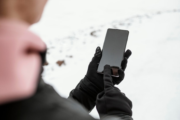 Close-up hands holding smartphone