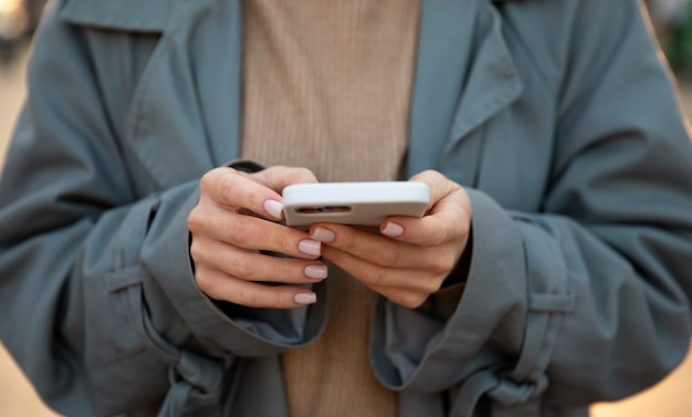 Close up hands holding smartphone