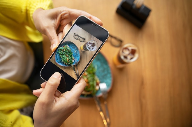 Close up hands holding smartphone