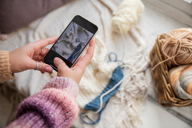 Close up hands holding smartphone