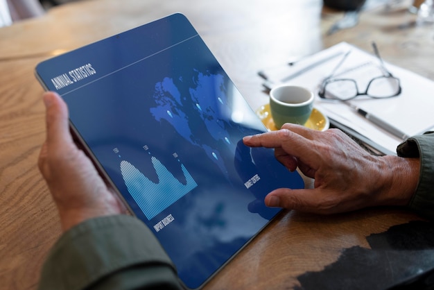 Close up hands holding tablet