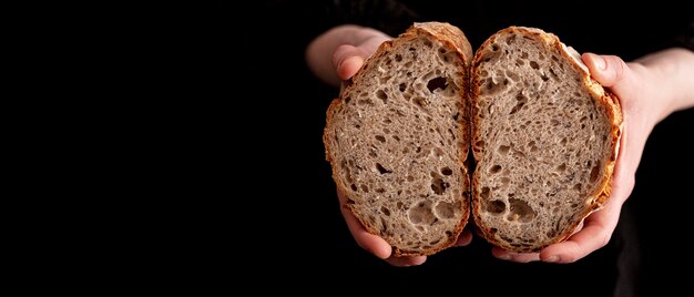 Close-up hands holding tasty bread