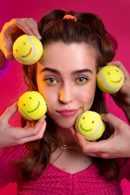 Close up hands holding tennis balls