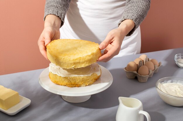 Close up hands making cake