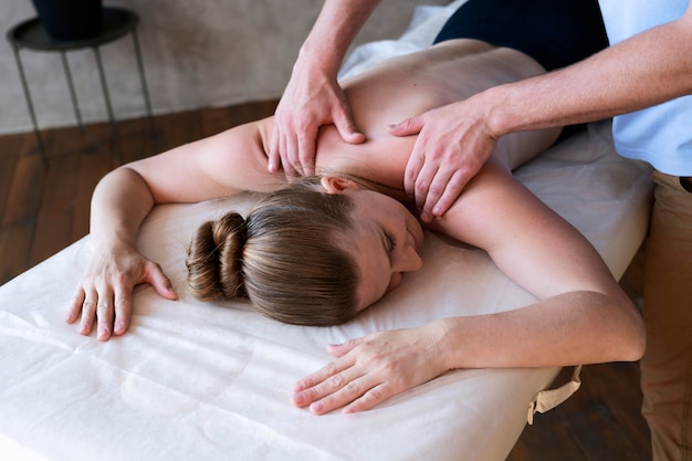 Close up hands massaging patient