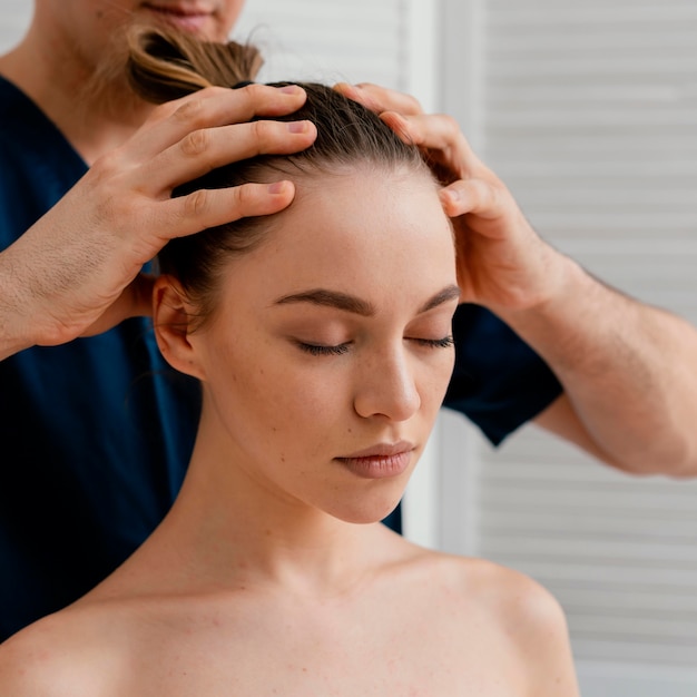 Close up hands massaging scalp