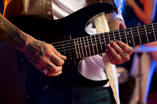 Close up hands playing the guitar