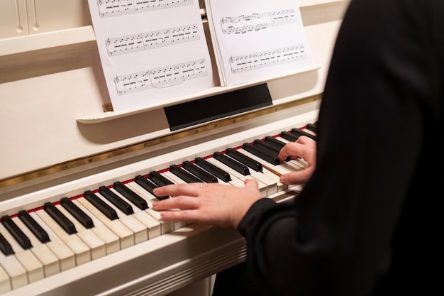 Close up hands playing the piano