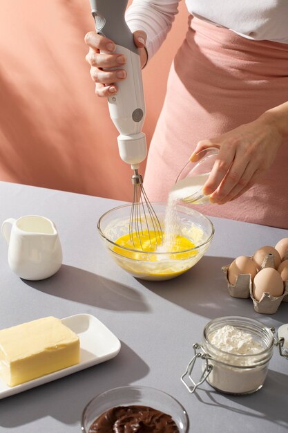 Close up hands preparing cake